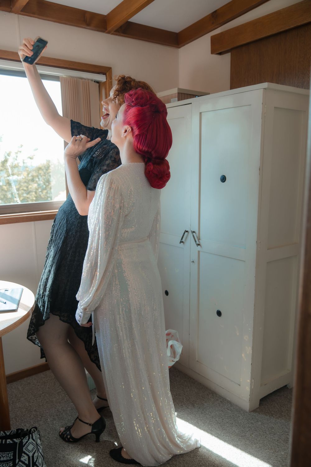Wedding Celebrant taking a selfie with bride in a farmhouse during an intimate country wedding morning