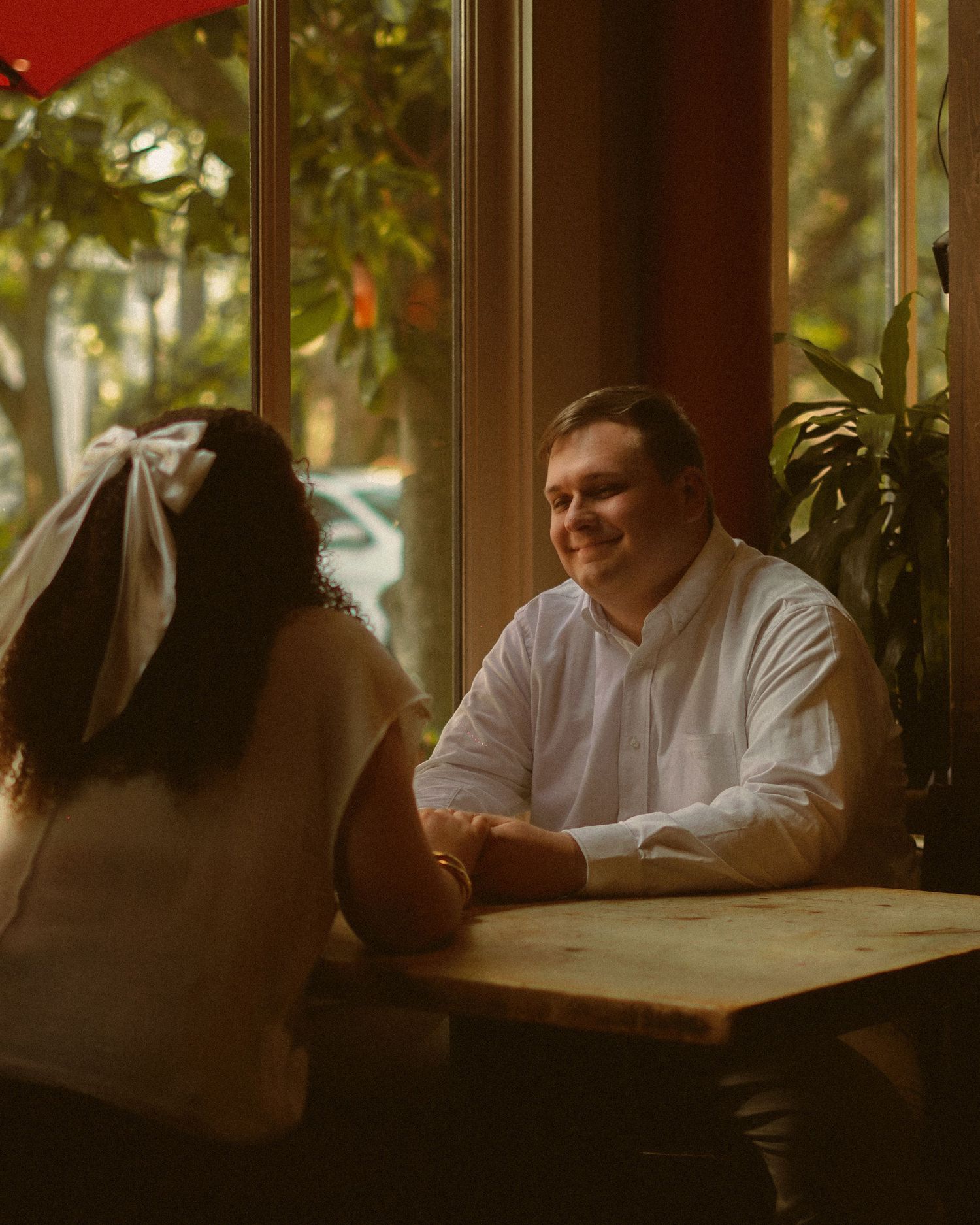 Couple and engagement session, capturing a timeless moment of the the couple in a restaurant. Capturing their authentic love.