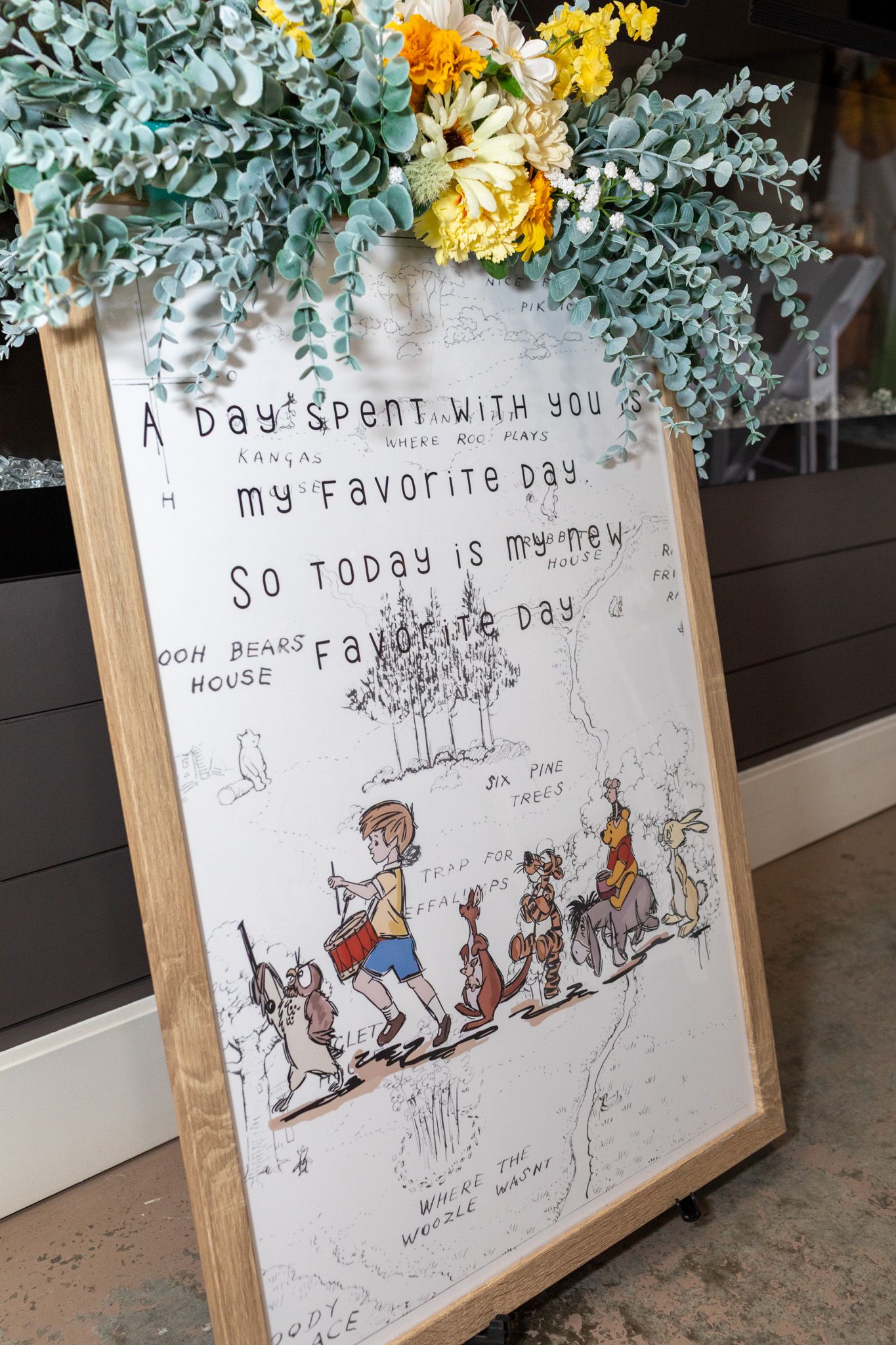 Winnie the Pooh quote sign reading A Day Spent With You Is My Favorite Day in wooden frame.
