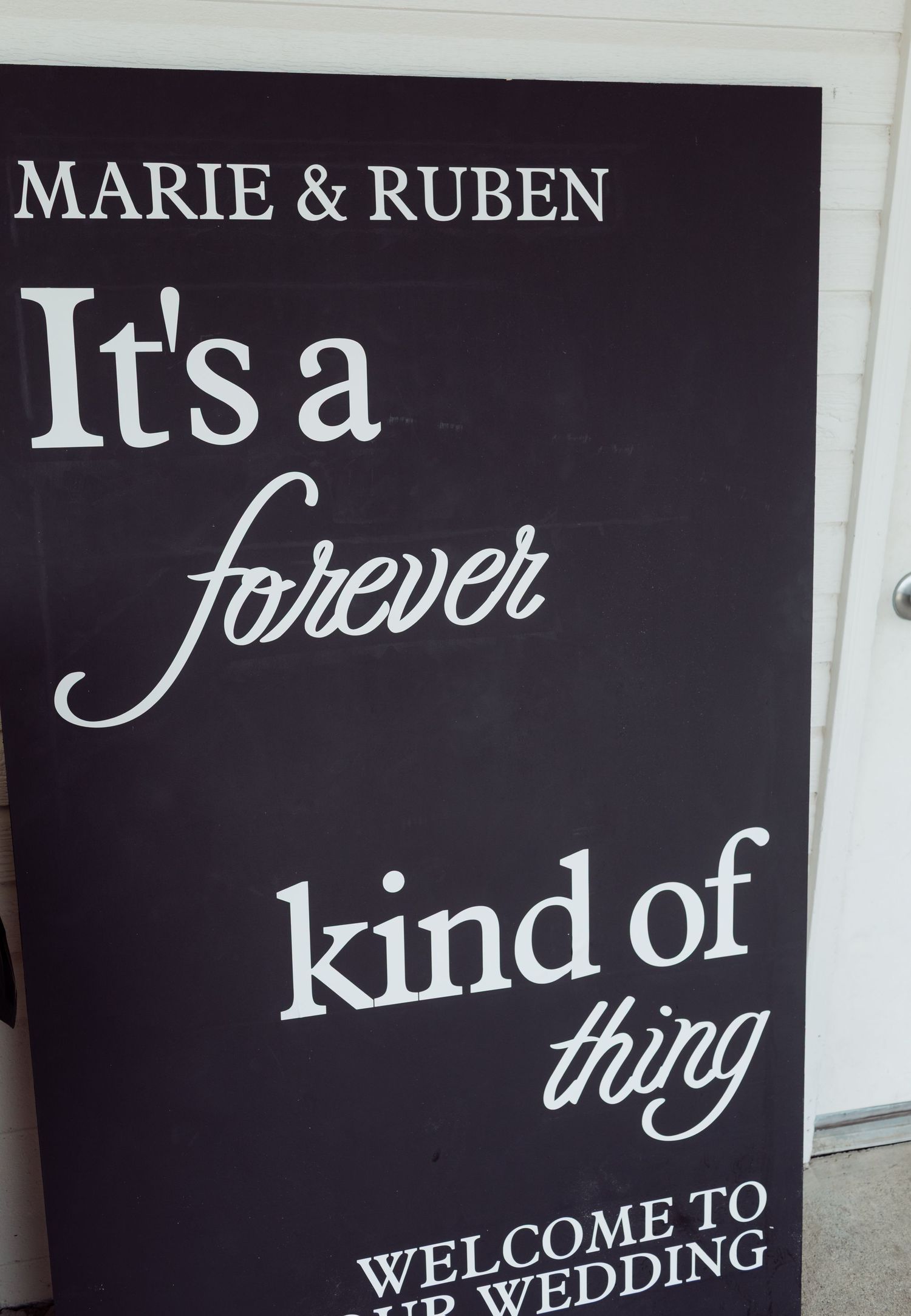 Black chalkboard wedding welcome sign for Marie and Ruben's forever wedding.