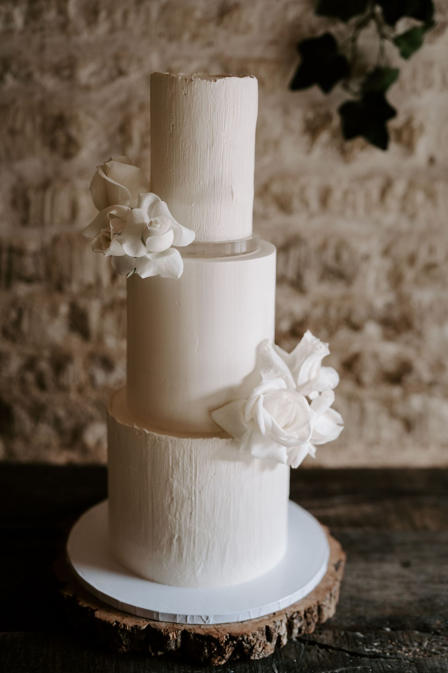 wedding cake during feast at yardspace old gore in cirencester