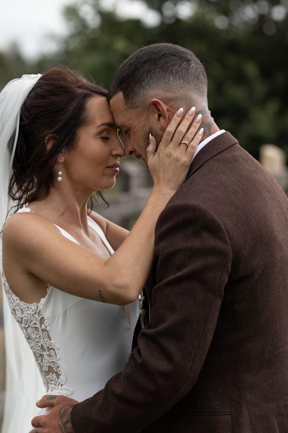 A tender moment between newlyweds as they embrace on their wedding day.