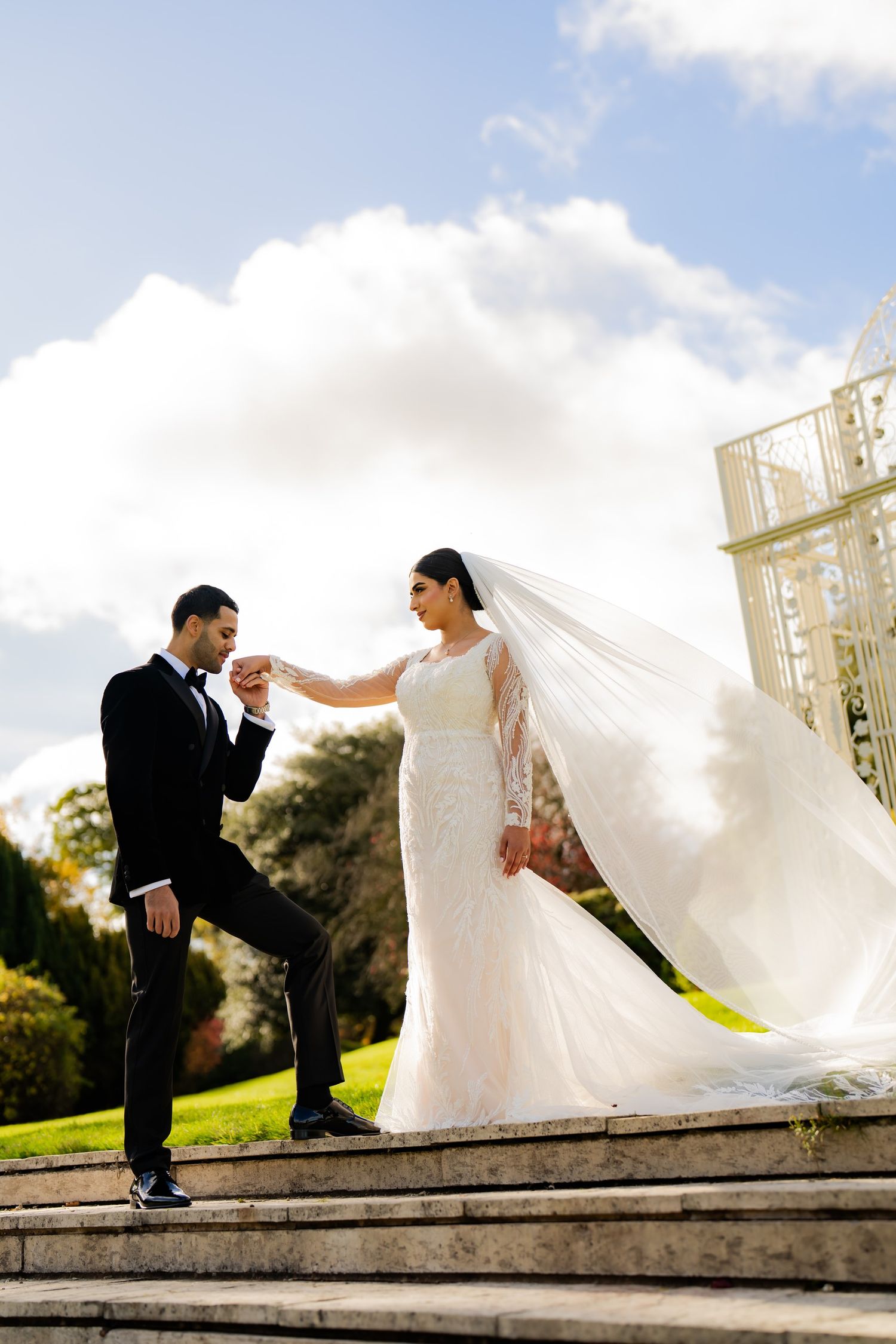 Wedding portraits beneath a flowing veil