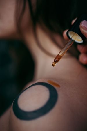 oil being applied to a shoulder, shot for a sunscreen brand in Mallorca
