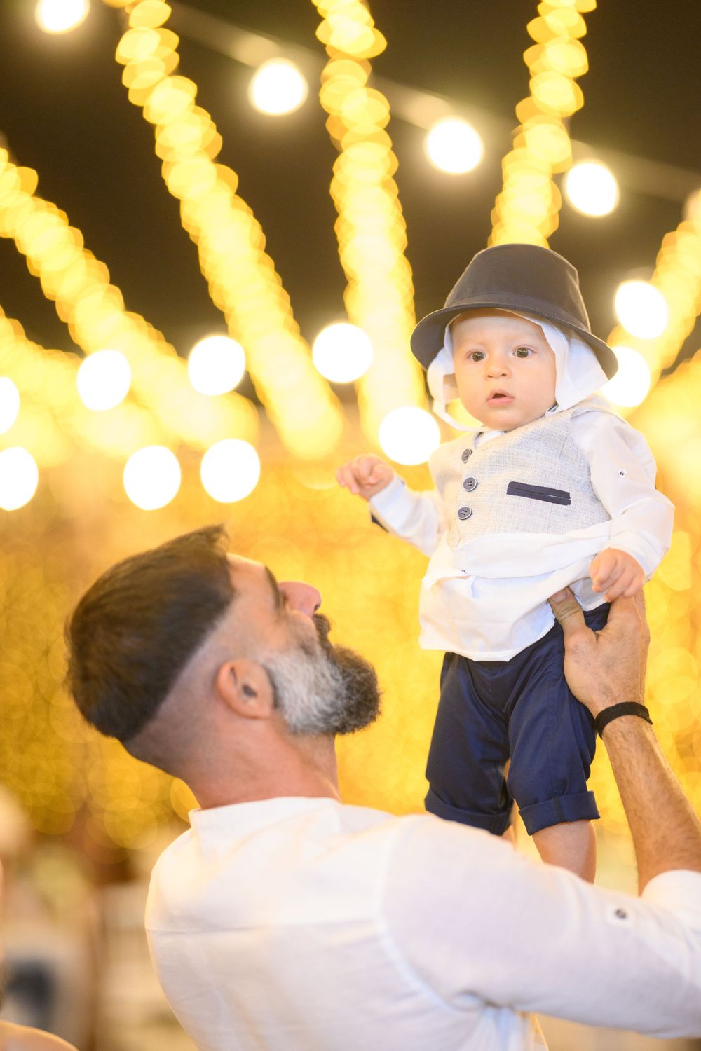 Festive scene with bokeh lights creating warm glowing streaks in the background.