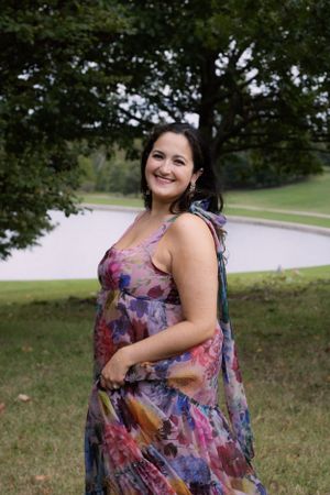 A woman twirling her dress outside for a birthday photoshoot in St. Louis, Missouri