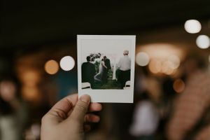 a polaroid photo of a couples first kiss at their wedding in Western North Carolina just outside of Asheville