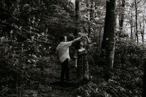 a black and white image of a couple having a dance in the woods in Western North Carolina just outside of Asheville