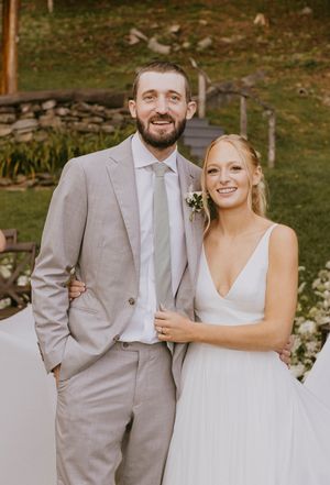 a bride and groom smile for a close up shot