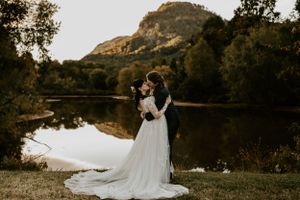 a couple share a romantic kiss at lake lure in chimney rock in Western North Carolina just outside of Asheville