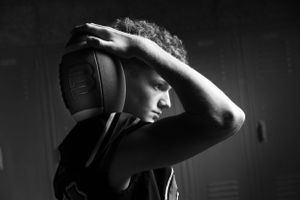 Dramatic black and white portrait of someone wearing headphones.