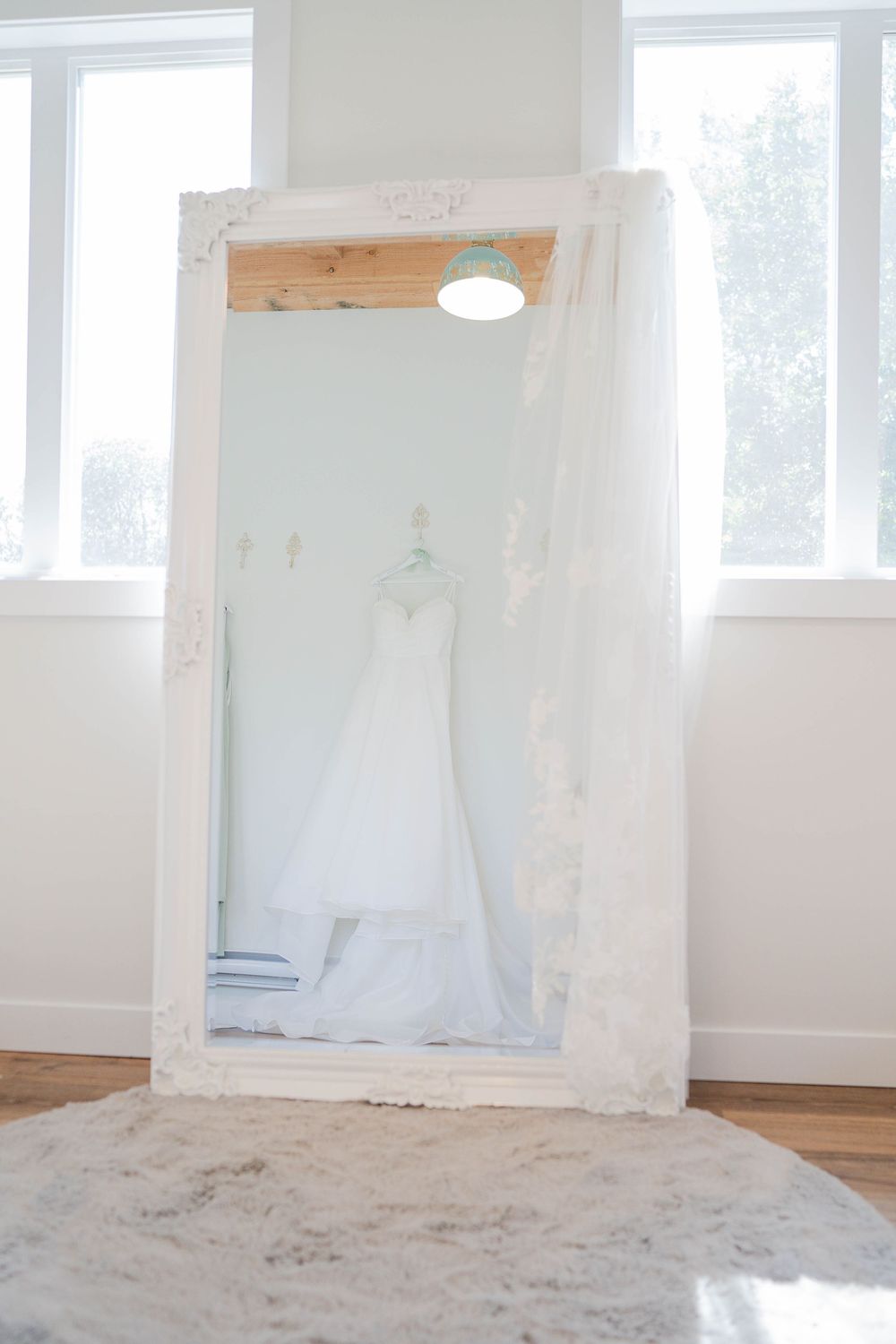 Series of minimal white interior photos showing an empty white-walled room with wooden beams and natural light.