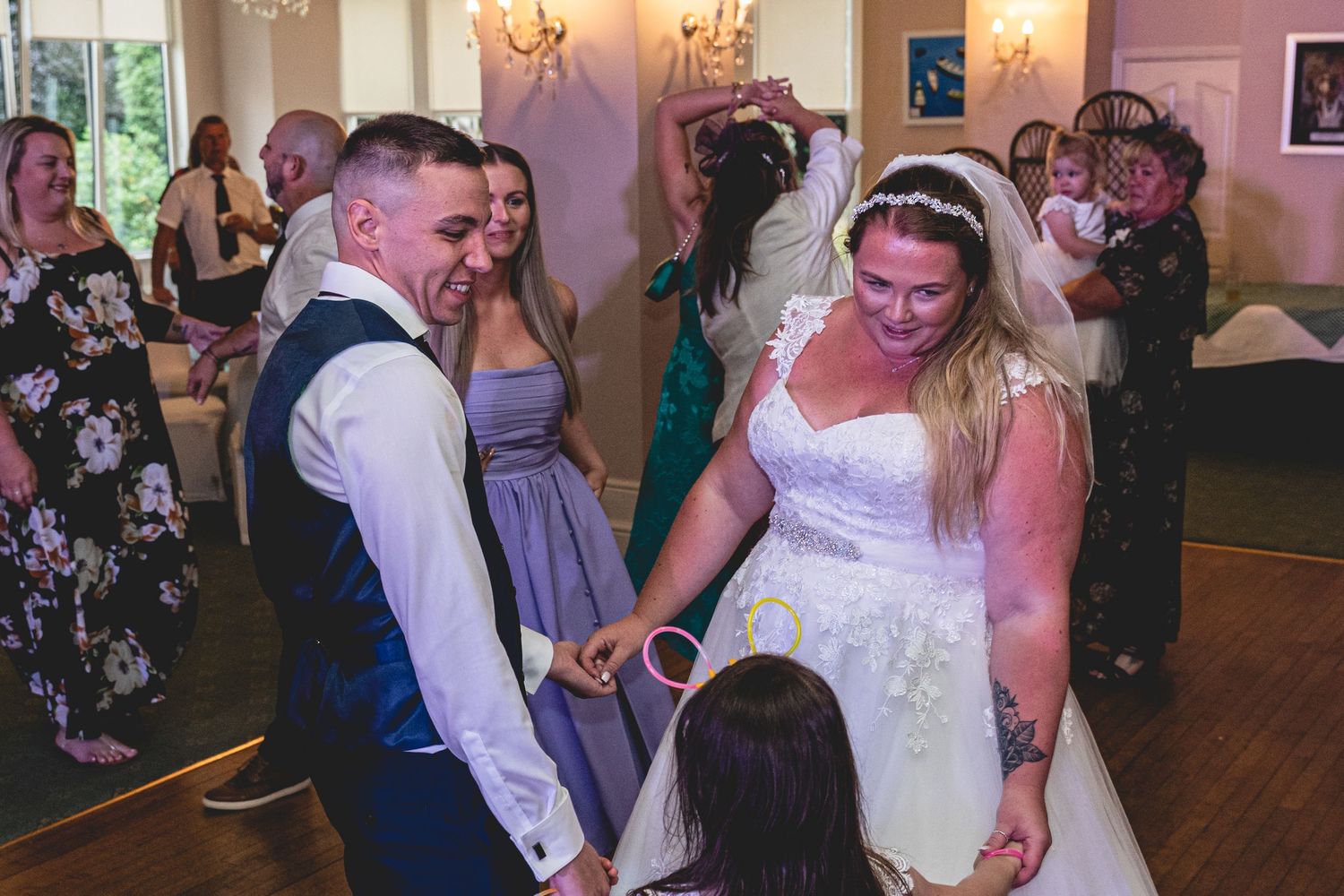 Wedding reception dance floor scene with guests celebrating. penmorvah Mannor Hotel, Falmouth Wedding. Cornwall Wedding Photographer.