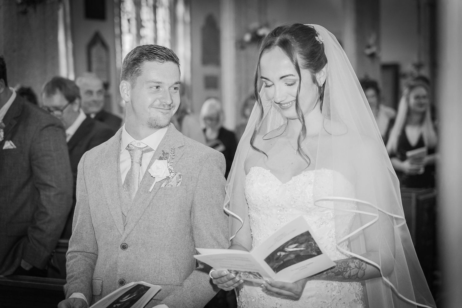 Wedding ceremony taking place inside a beautiful traditional church.