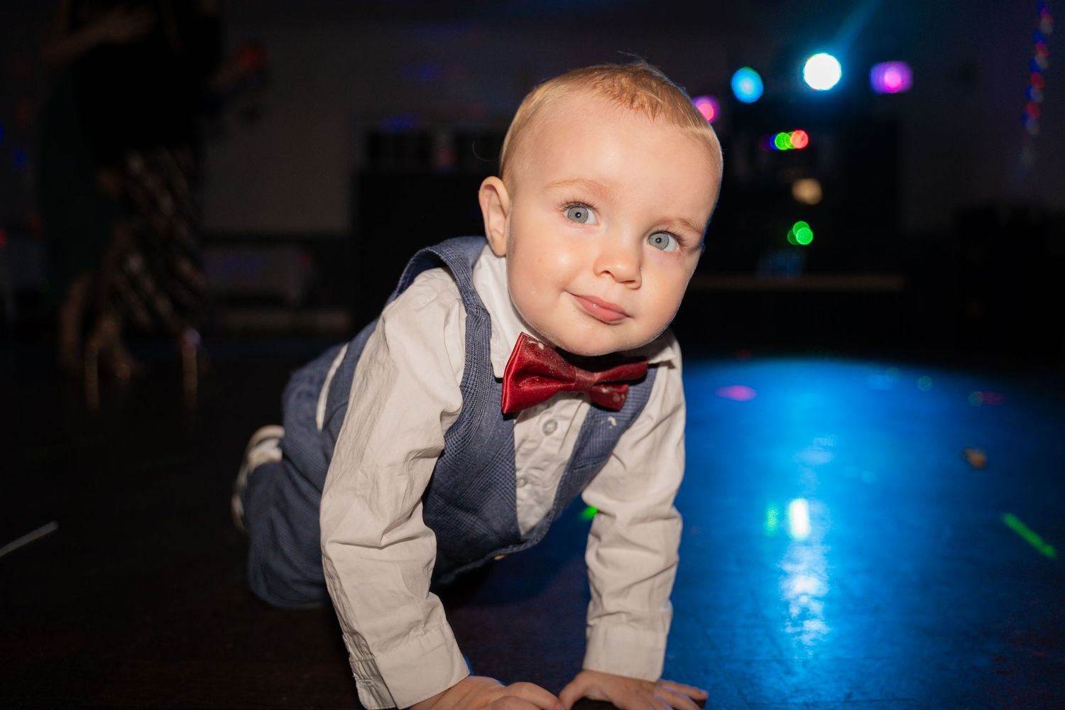 A collage of formal event photos showing children in dress clothes with colorful lights in the background.