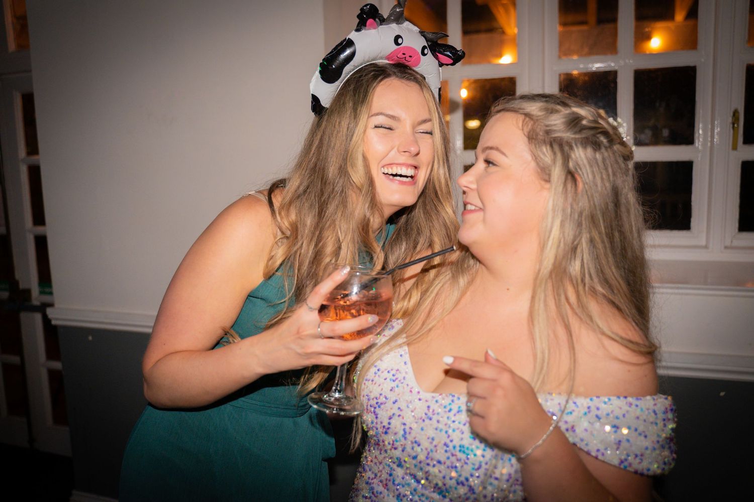 Five sequential photos show friends laughing and enjoying drinks together at an evening gathering.