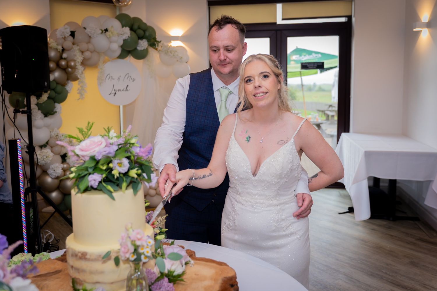 Wedding celebration moments captured in venue with romantic lighting and decorative elements.