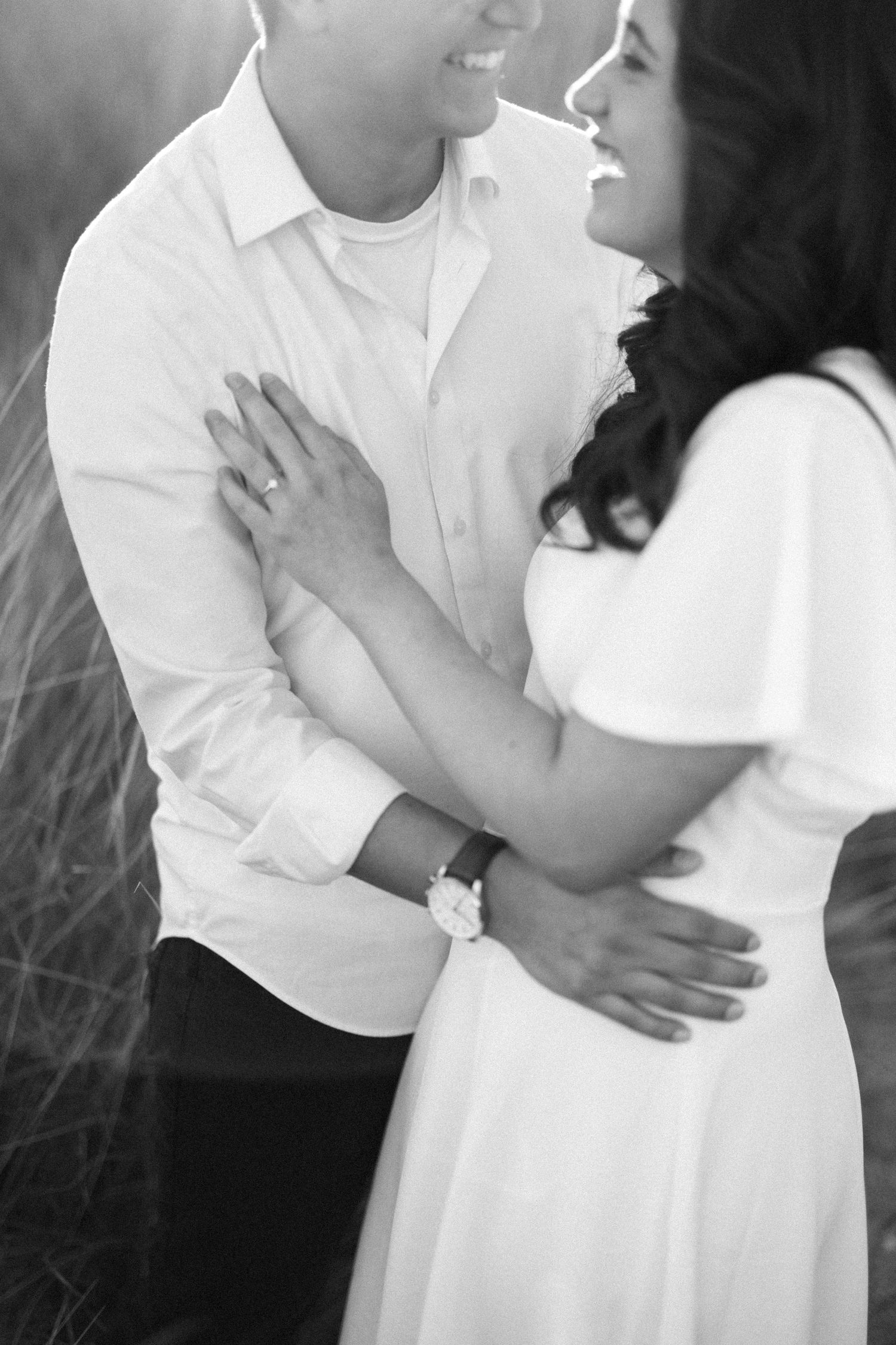Laughing engagement photo of Caleb & Jazzlin.