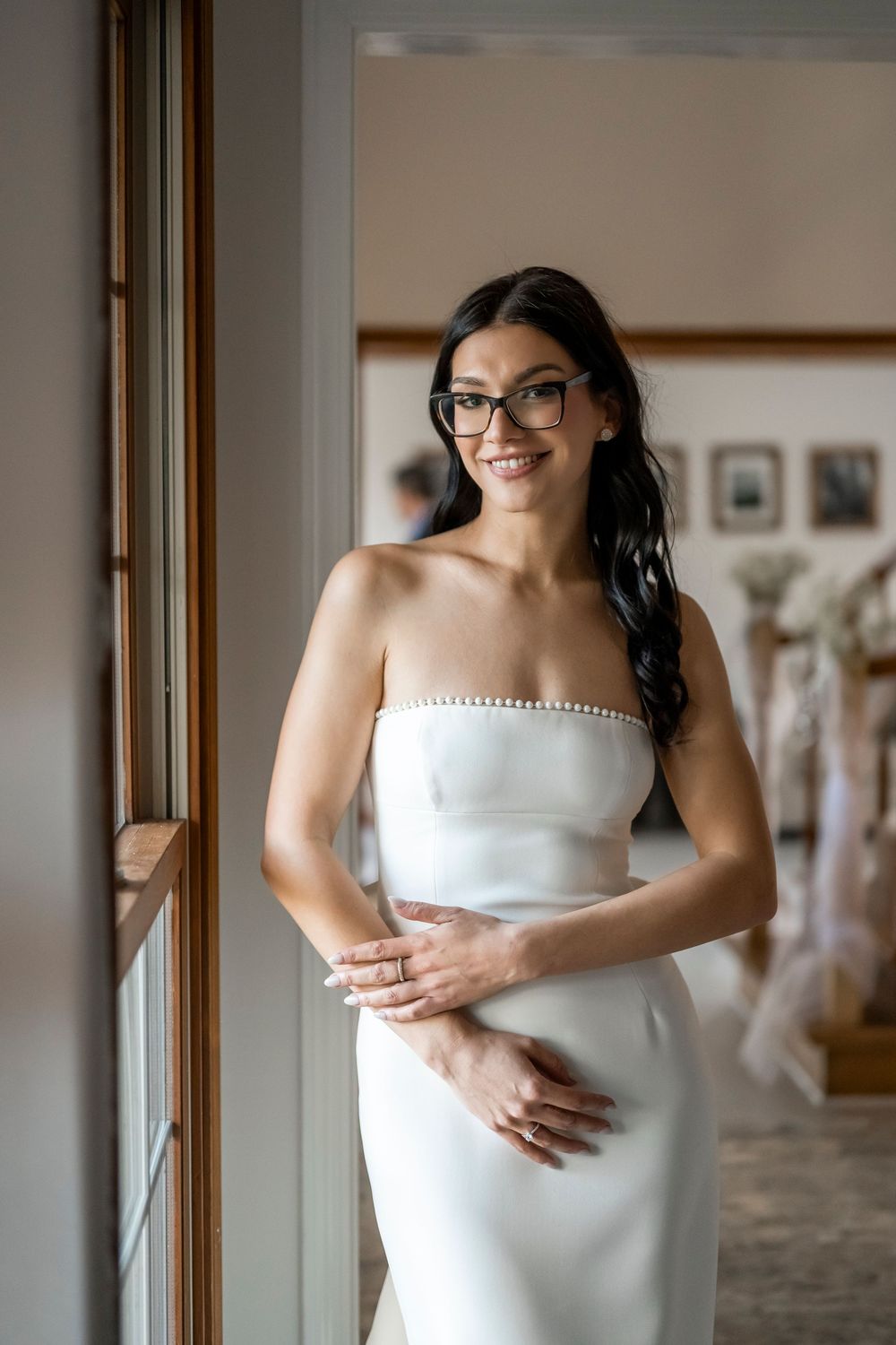 A series of intimate wedding dress detail shots showing delicate buttons and lace in an indoor setting.