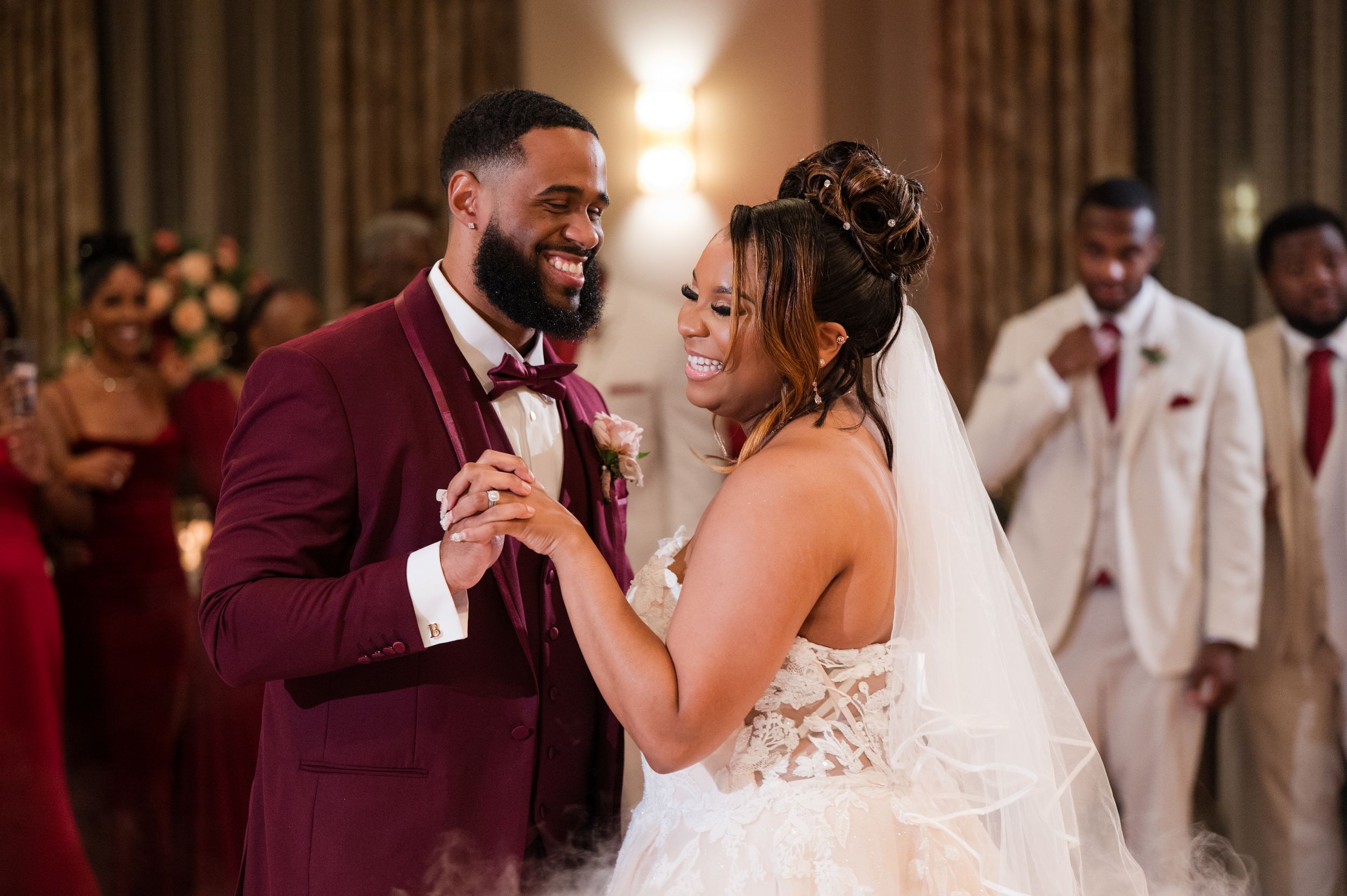 Newlyweds share an intimate moment on the dance floor during their wedding reception.