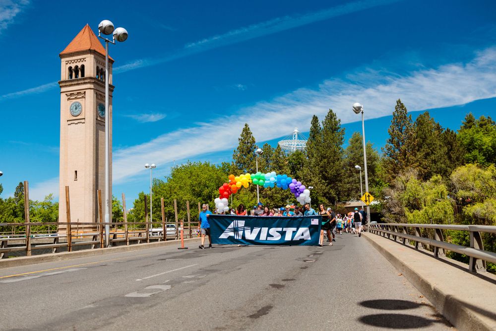 A large banner featuring the prominent Spokane clock tower in the background, showcasing its architectural details and grandeur.