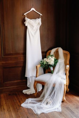 A row of four views showing a hanging white wedding dress with flowing train and veil on a wooden chair against dark walls.