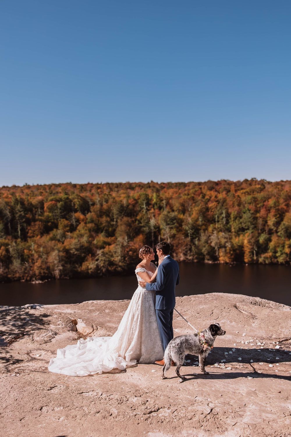 After saying I do, bride and groom together at minnewaska state park elopement overlooking the mountains on a cliff