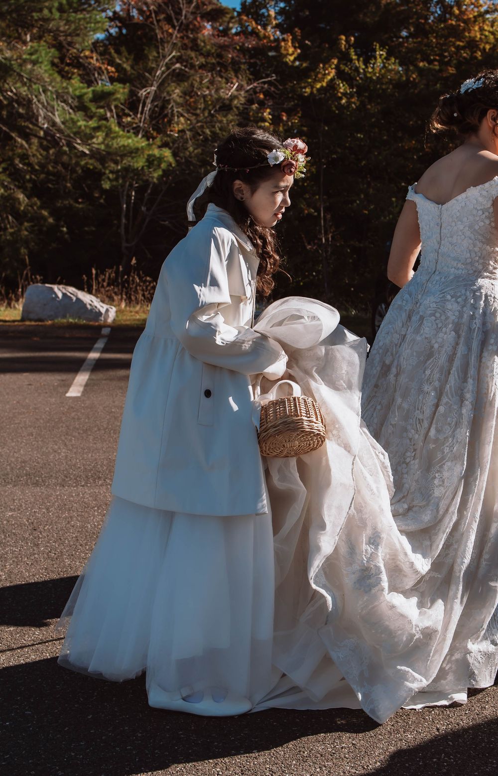 Flower girl carrying bride's dress at Minnewaska State Park Adventure Elopement