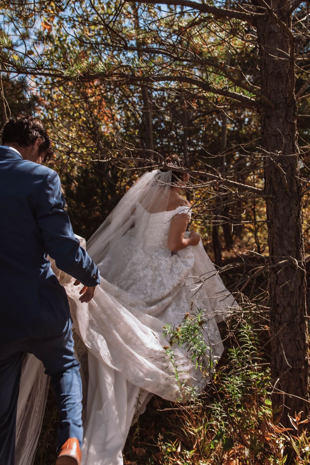 Couple hiking through the forest together after saying I Do at minnewaska adventure elopement