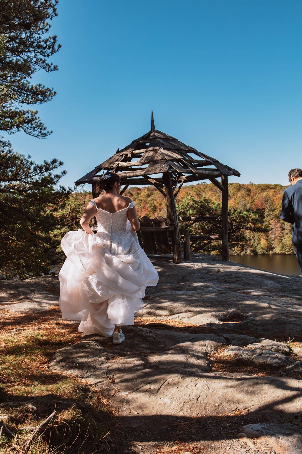 Bride running to her groom at Minnewaska state park elopement with Cliffs and sweeping mountain views