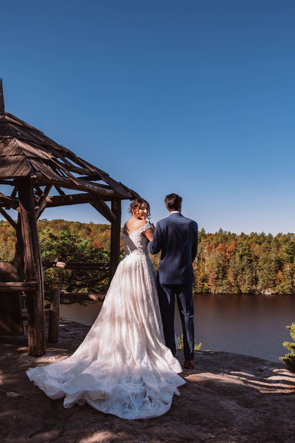 Bride looking back at the camera during a candid moment at her minnewaska state park adventure elopement