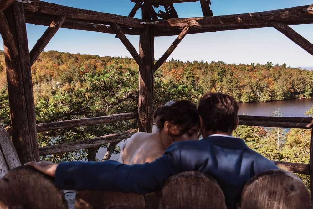 Bride and groom sharing a moment before they say their vows with sweeping mountain views at minnewaska state park adventure elopement
