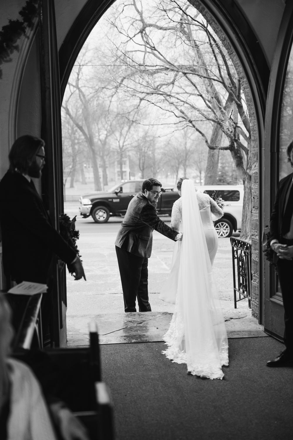 Series of black and white photographs showing wedding day moments at a church entrance.