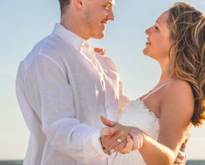 Sea Glass Photography of Navarre, Florida offers stunning couples beach portrait in Navarre Beach, Fl.  Help with proposals.