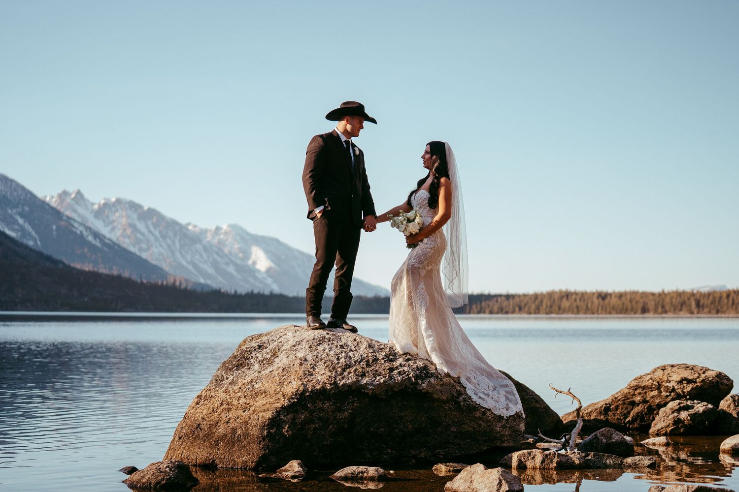 Candid moment between newlyweds during Jackson Hole mountain wedding