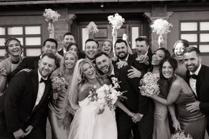 Black and white candid shots of wedding party members laughing and celebrating together.