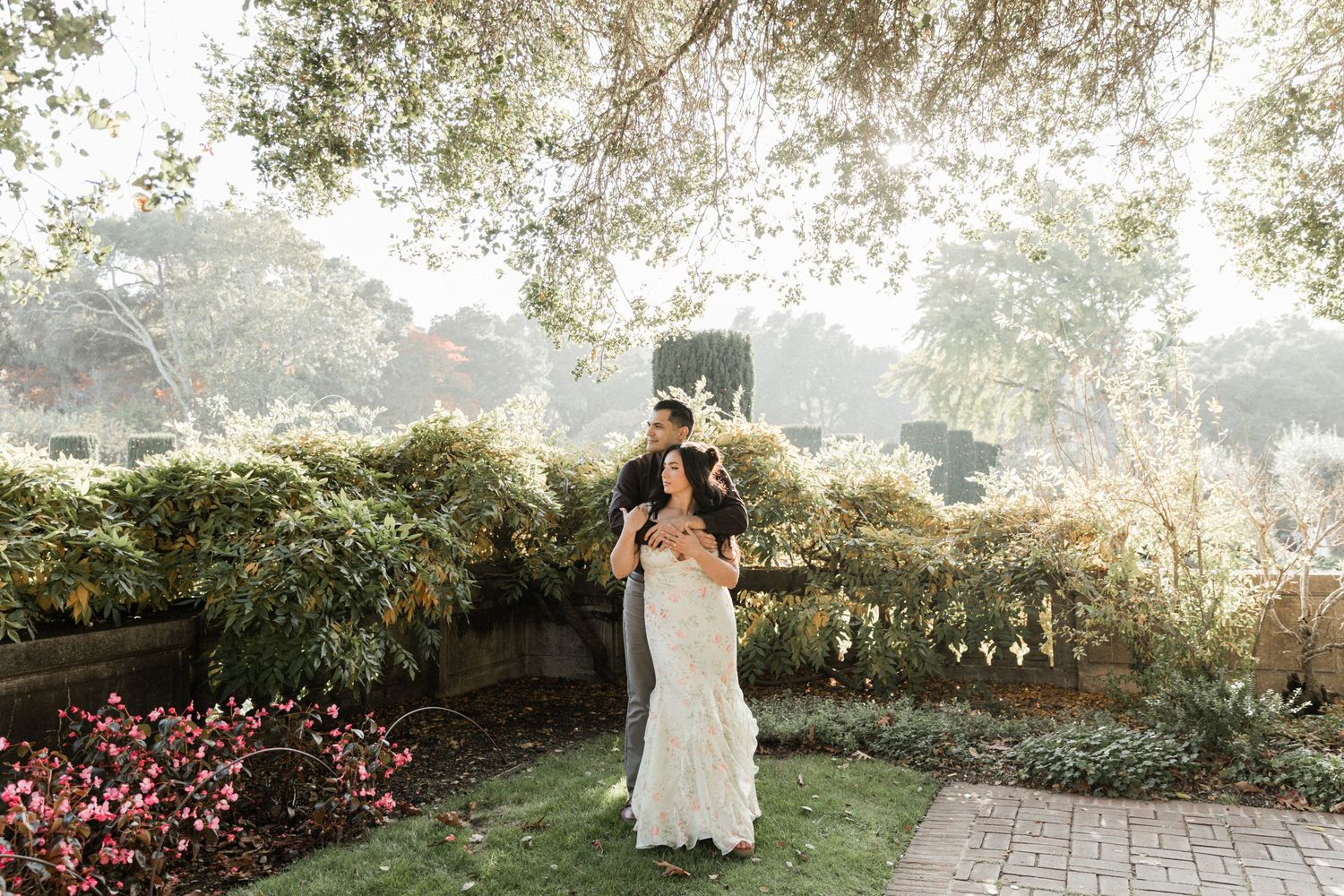 bride and groom walk in front of the sunset after getting married in Paso Robles California at Cass Winery.