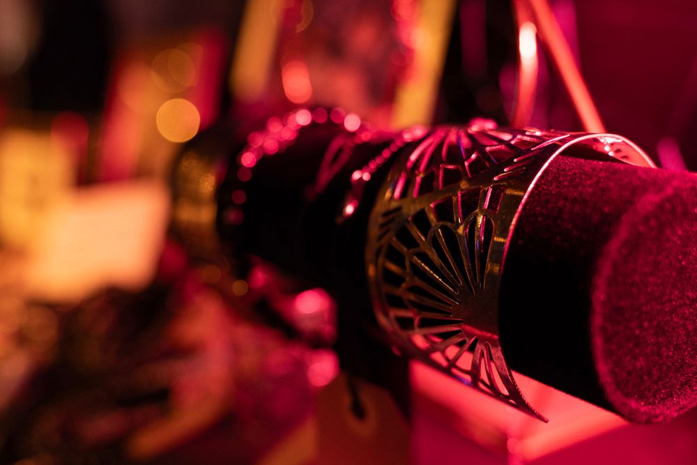Close-up of a colorful, intricate festival or rave wristband accessory.