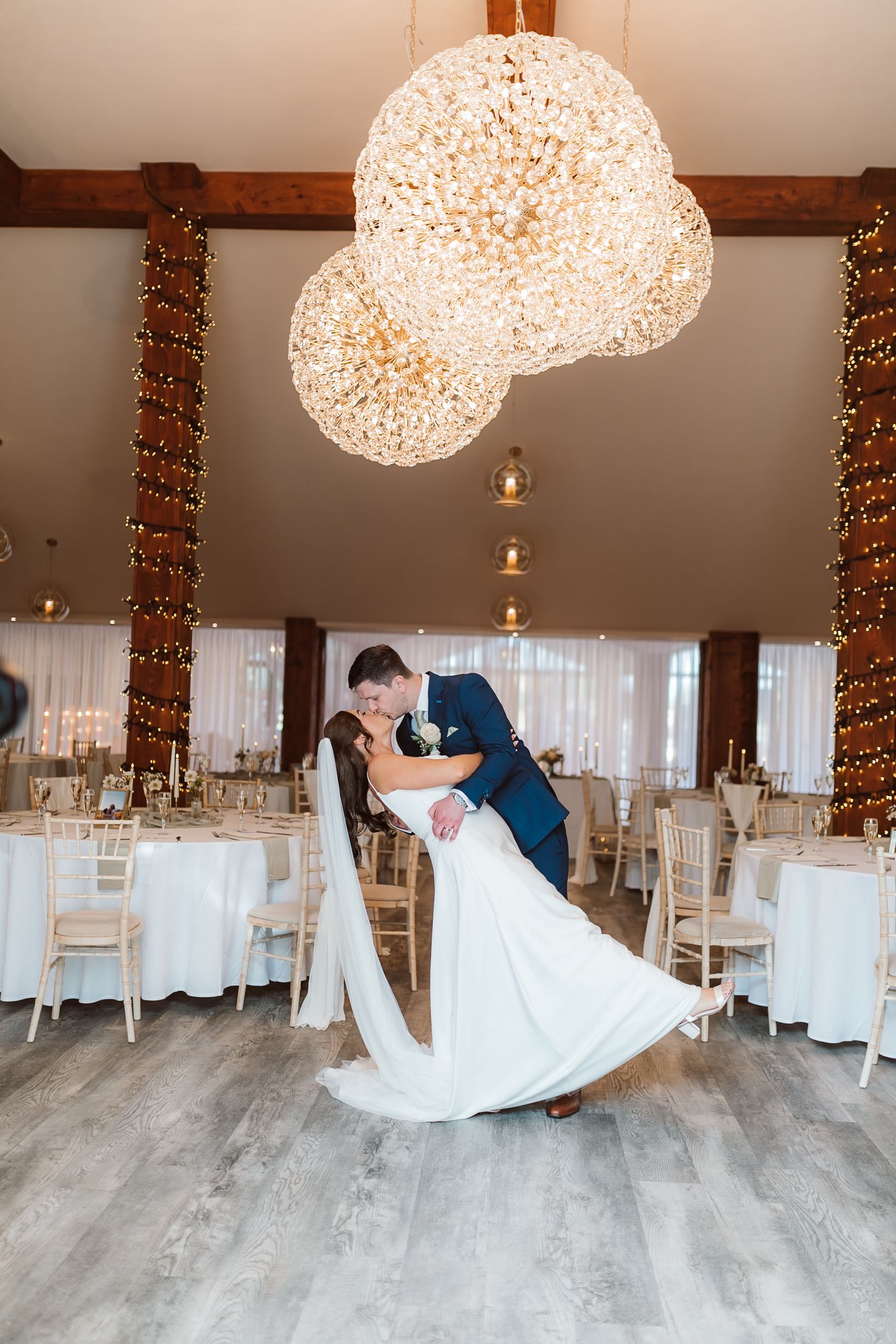 Elegant ballroom dance dip under sparkling sphere lights at wedding reception. Photographer. Hull. East Yorkshire. Photography