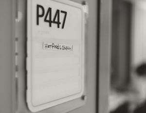Hospital hallway with P447 sign visible on wall.