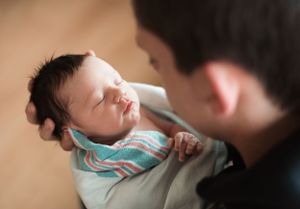 Close-up view of feeding time with a young infant.