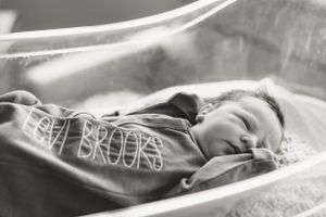 Dreamy portrait of sleeping infant with window light creating ethereal glow in Florence SC at McLeod Regional Medical Center for Fresh 48.