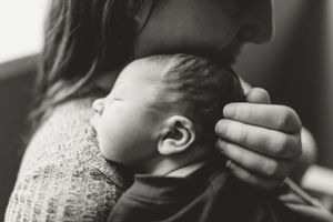Artistic black and white close-up of sleeping newborn during Fresh 48 photo session.