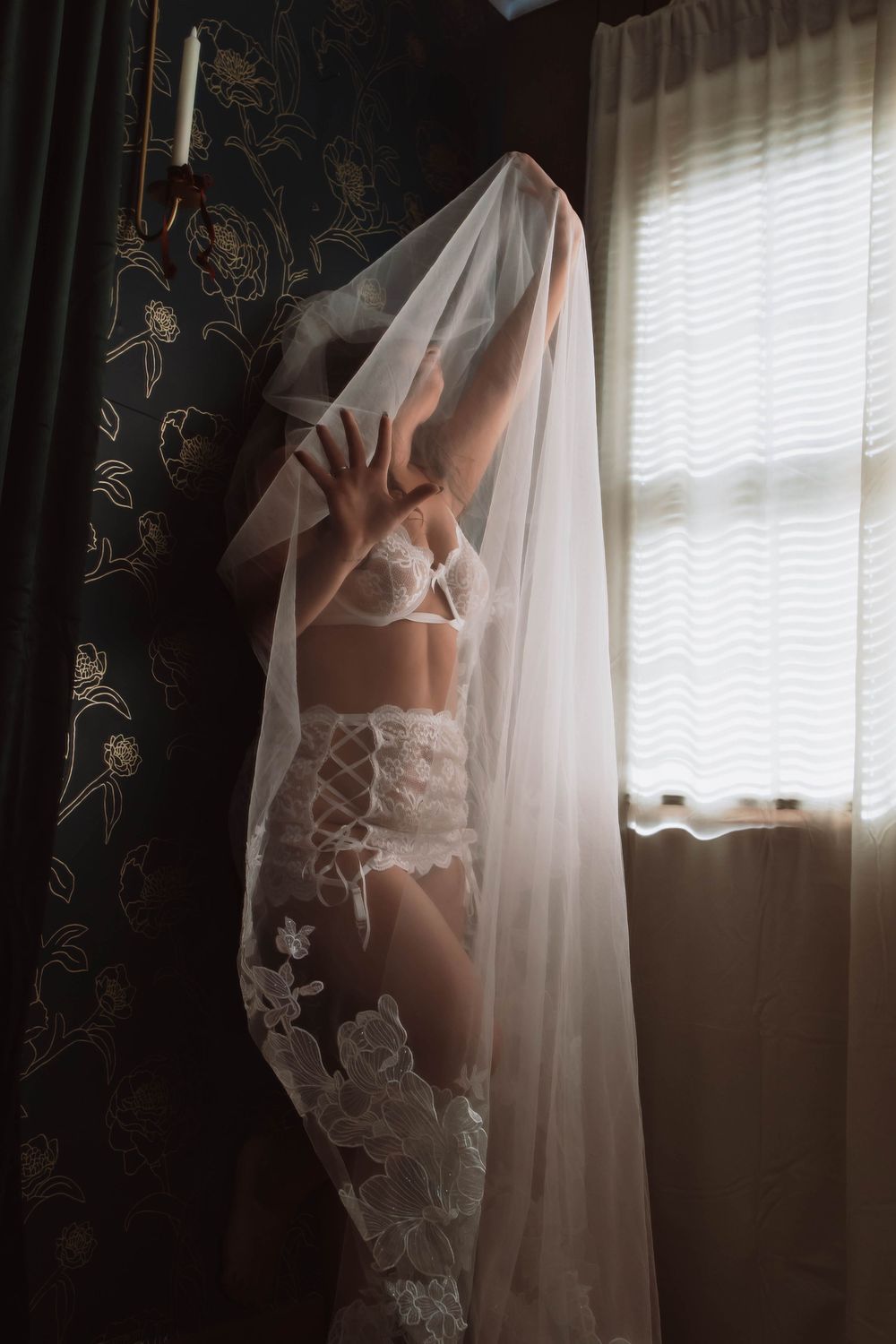 cinematic bridal boudoir portrait focused on emotion and atmosphere