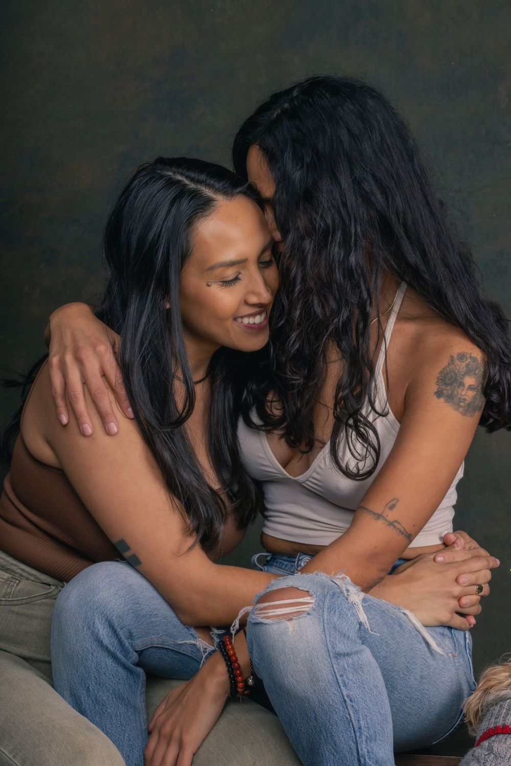 Intimate portrait series showing two people in casual attire sharing tender moments.