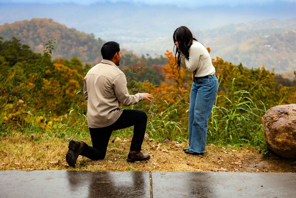A panoramic sequence of people enjoying a scenic mountain overlook during autumn with colorful fall foliage.