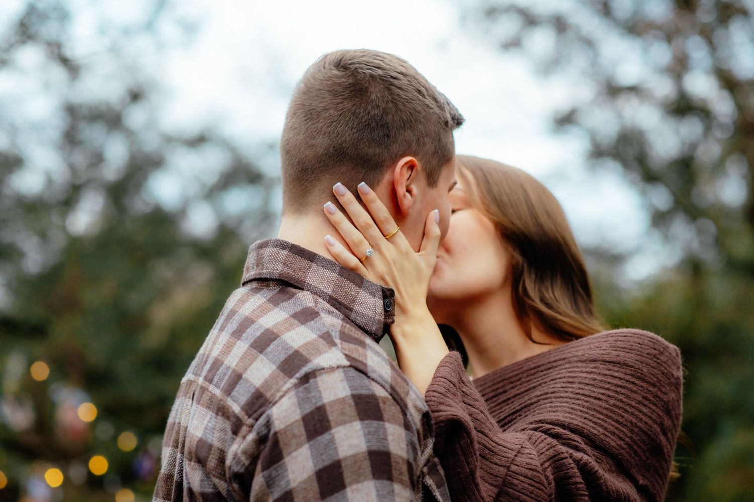 Couple kissing during their engagement photoshoot with Taryn Elizabeth, one of the photographers in Enid OK.