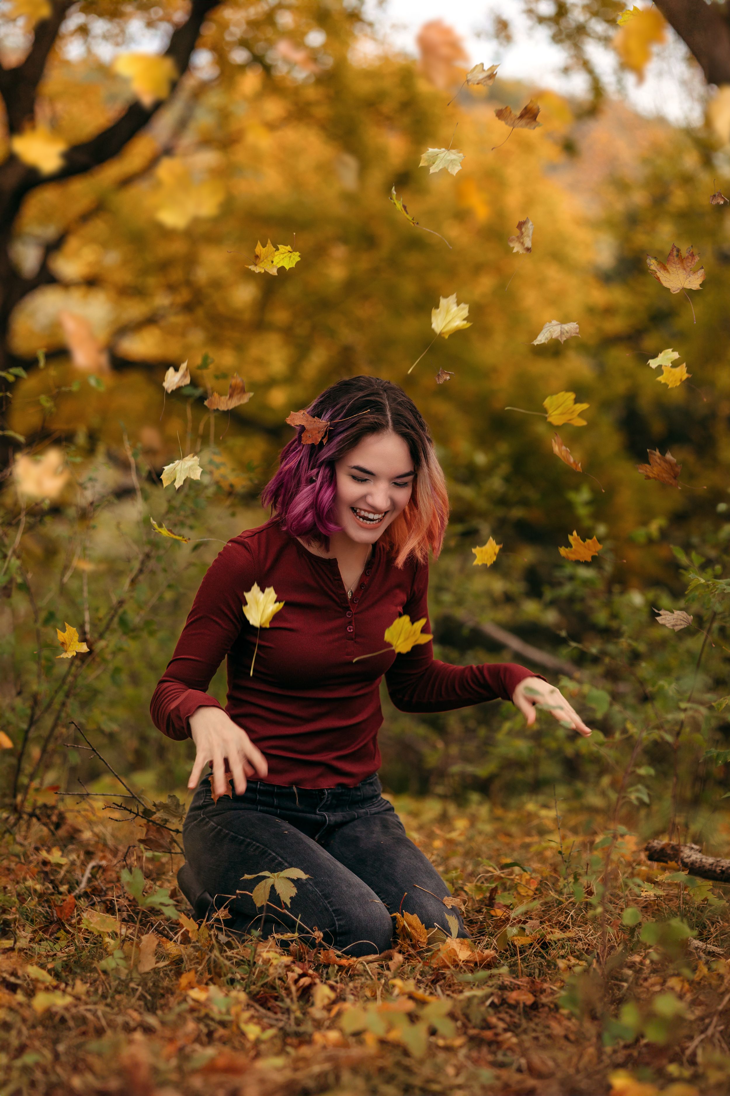 Minnesota high school senior playing in the leaves