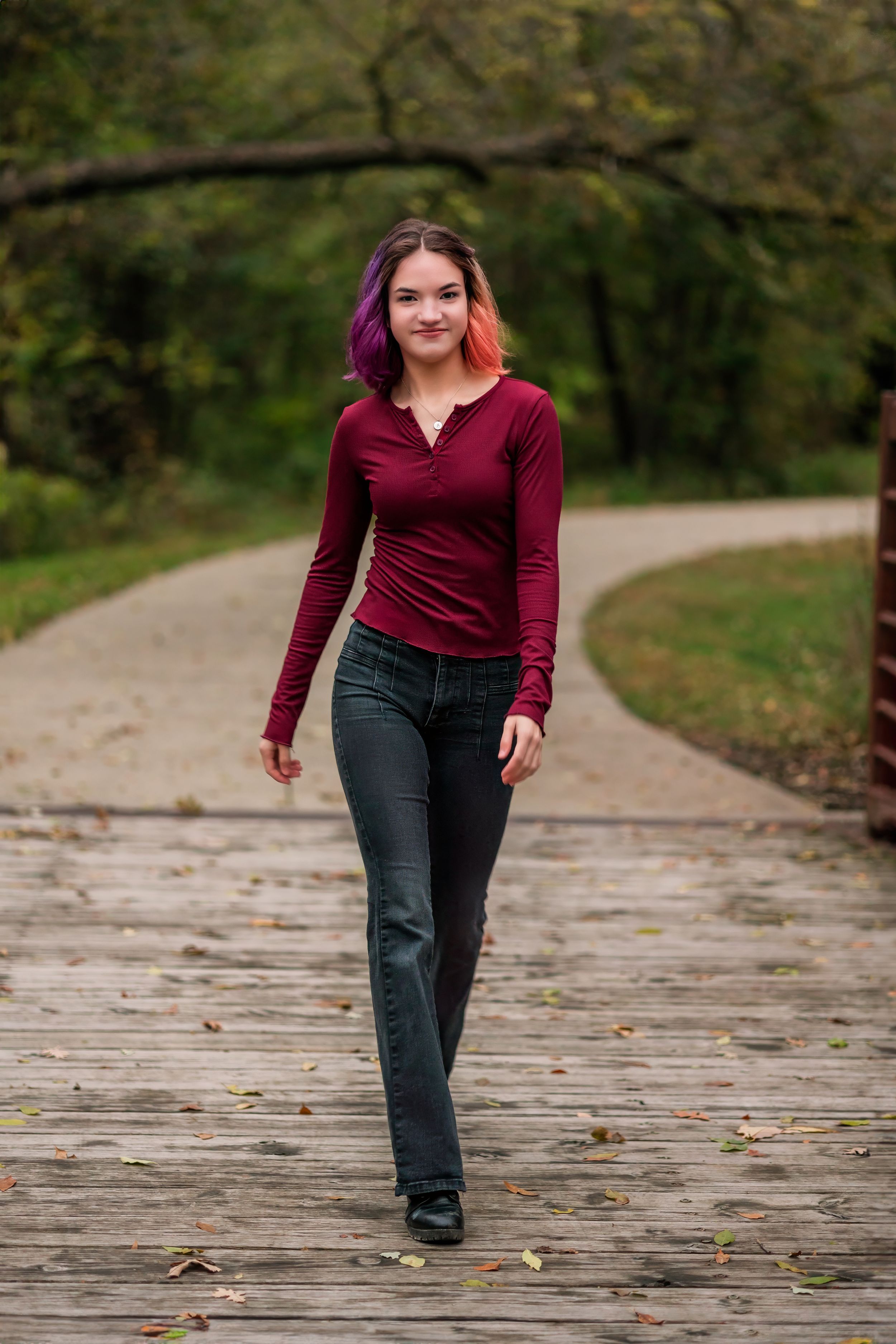 High school senior walking at the park