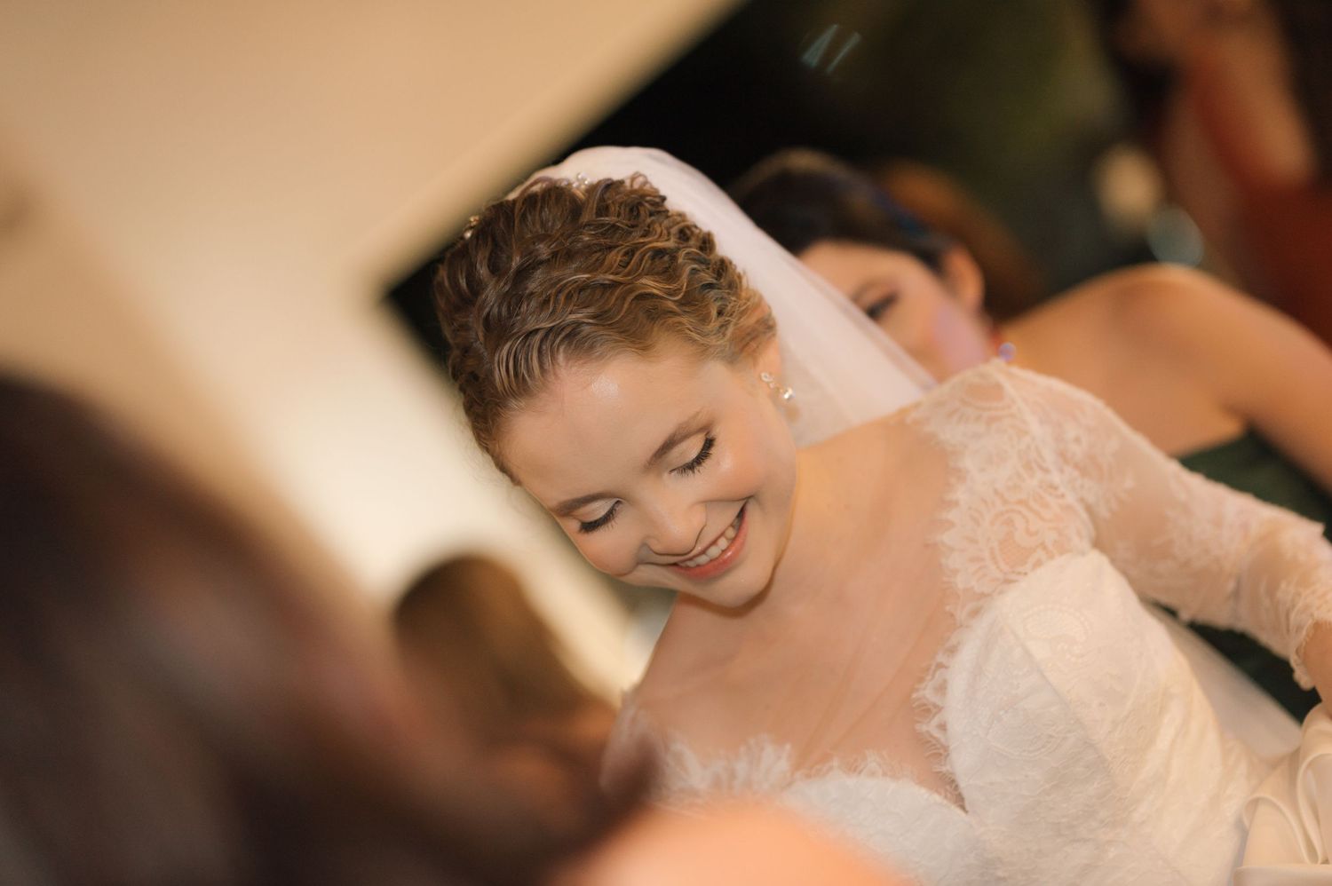 A candid moment of pure joy and laughter during a wedding celebration.